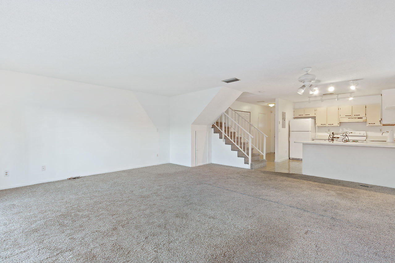 8815 Southwest 21st Street, Unit D Boca Raton, FL 33433 - Photo 9 of 27 a view of an empty room with a kitchen