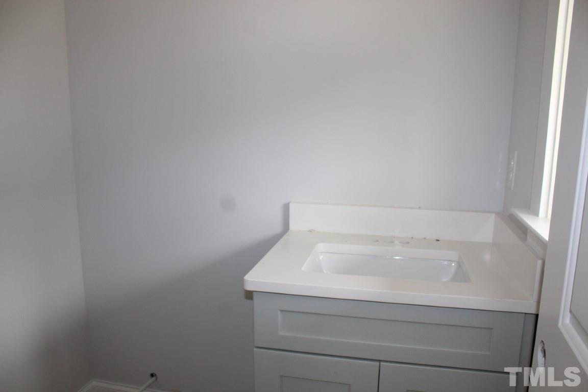 320 Prides Crossing Rolesville, NC 27571 - Photo 12 of 23 a bathroom with a bathtub
