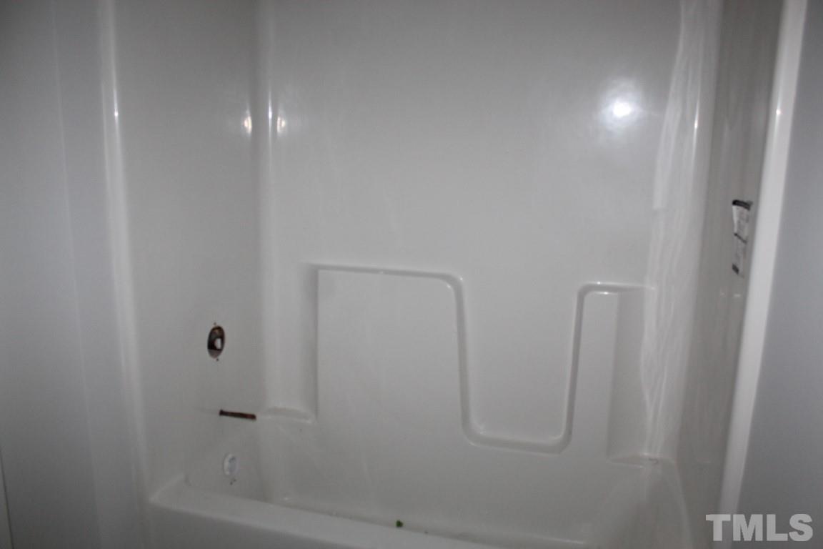 320 Prides Crossing Rolesville, NC 27571 - Photo 13 of 23 a bathroom with a shower