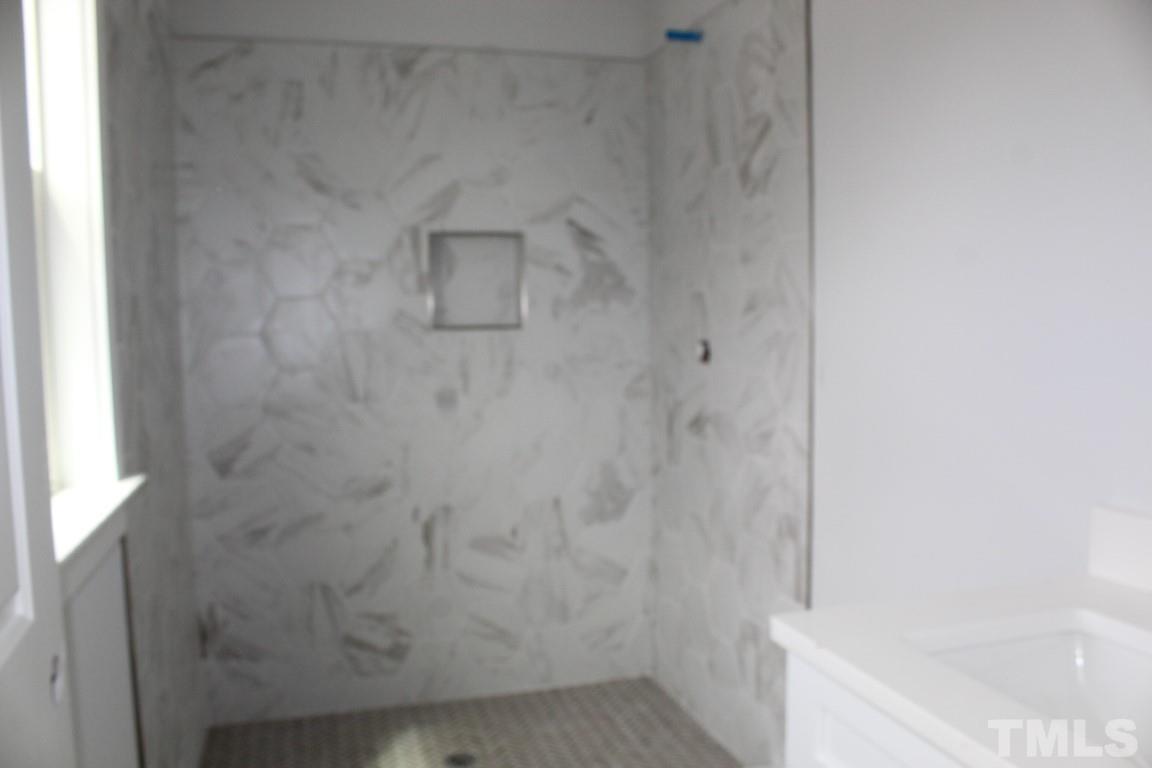 320 Prides Crossing Rolesville, NC 27571 - Photo 17 of 23 a bathroom with a shower