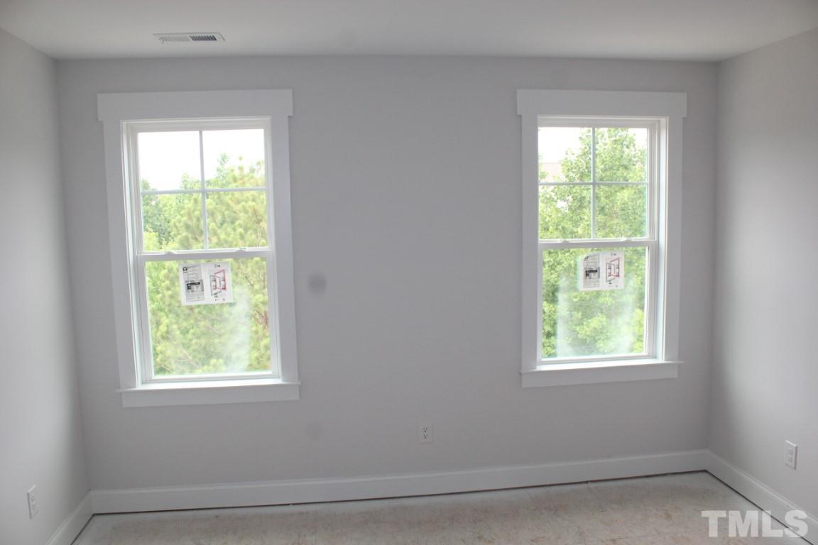 320 Prides Crossing Rolesville, NC 27571 - Photo 18 of 23 a view of an empty room with a window