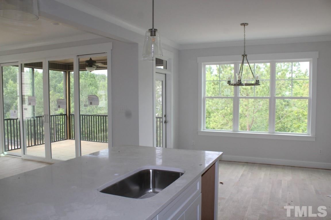 320 Prides Crossing Rolesville, NC 27571 - Photo 4 of 23 a kitchen with windows and refrigerator