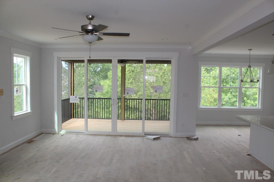 320 Prides Crossing Rolesville, NC 27571 - Photo 6 of 23 a view of an empty room with a balcony