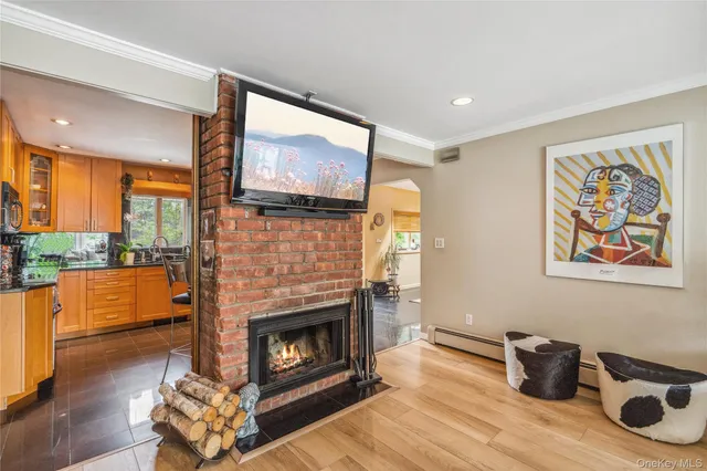 a living room with furniture fireplace and flat screen tv