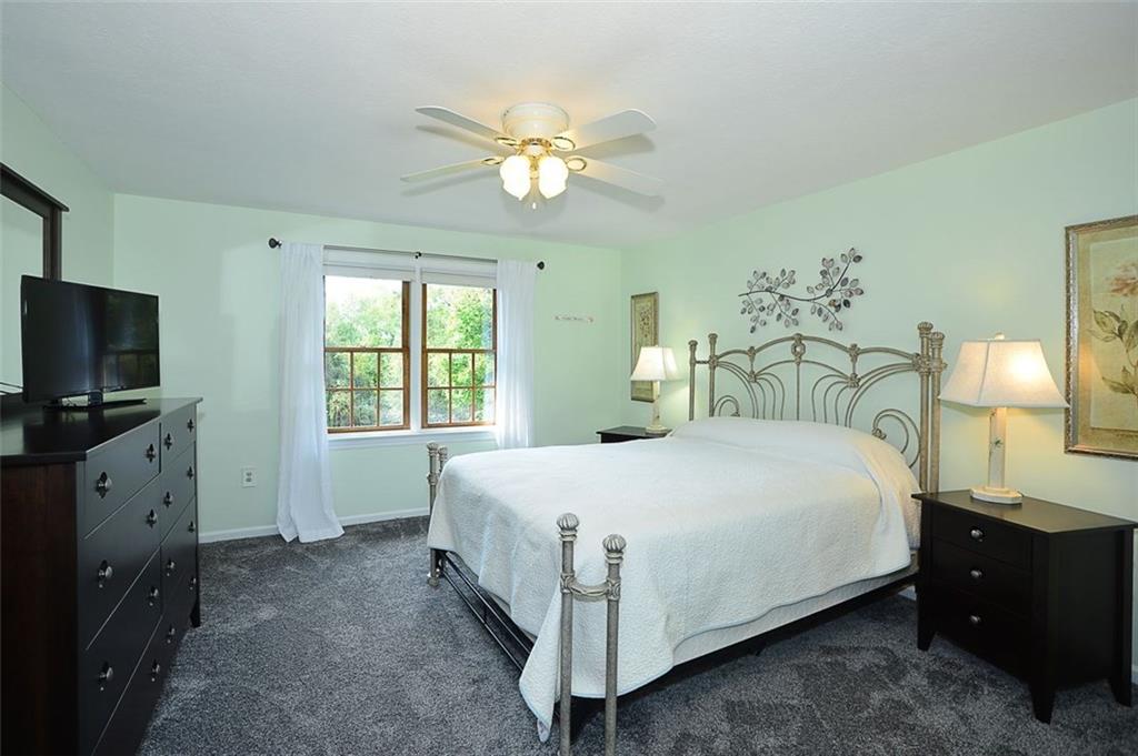 130 Ridgeview Lane Harmony, PA 16037 - Photo 13 of 24 Updated Master is located on the MAIN FLOOR of the home & has walk-in closet, 2018 updated Master Bath & a wonderful view of the rear of the property.