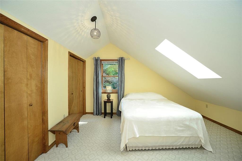 130 Ridgeview Lane Harmony, PA 16037 - Photo 16 of 24 Bedroom 2 is located UPSTAIRS and enjoys (2) very large closet/storage areas, a ever cheery skylight and a trendy light fixture.