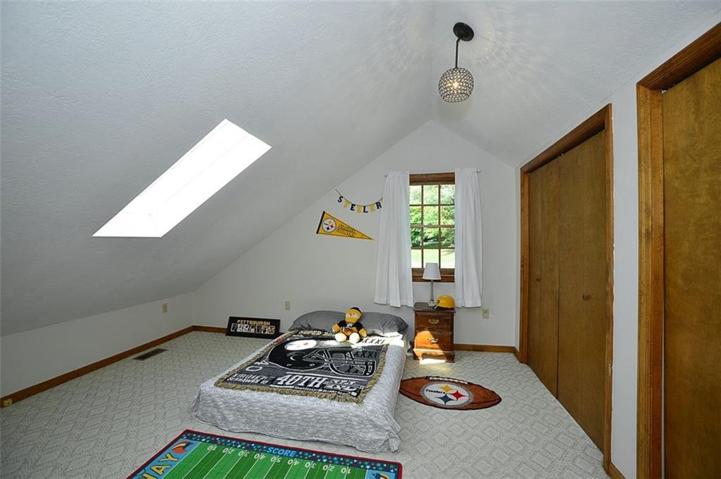 130 Ridgeview Lane Harmony, PA 16037 - Photo 17 of 24 Bedroom 3 is also located UPSTAIRS and enjoys (2) very large closet/storage areas, a ever cheery skylight and a trendy light fixture.