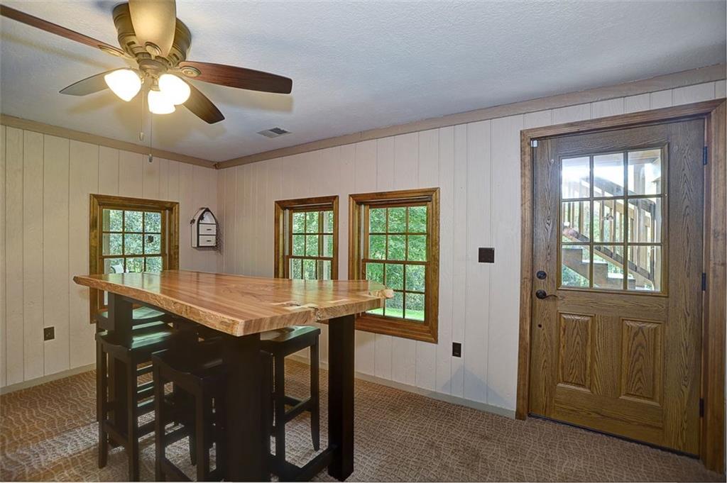 130 Ridgeview Lane Harmony, PA 16037 - Photo 20 of 24 View2 of Family Room with walk out door to concrete patio, plenty of windows for light and a FULL BATH.