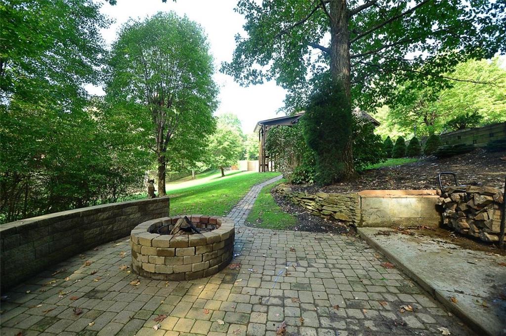 130 Ridgeview Lane Harmony, PA 16037 - Photo 5 of 24 Custom and private fire pit area on side yard.