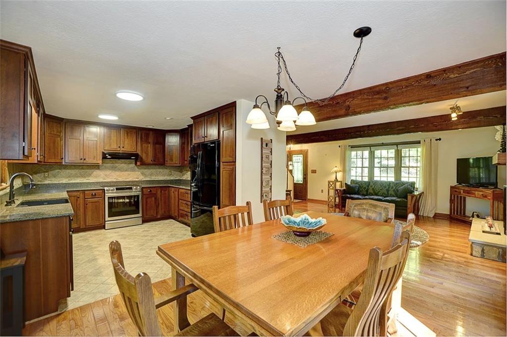130 Ridgeview Lane Harmony, PA 16037 - Photo 10 of 24 This image shows the high-functionality of the kitchen, dining & living rooms. Cherrywood, oak, ceramic & quartz are the materials seen in this image. COUNTRY QUALITY!