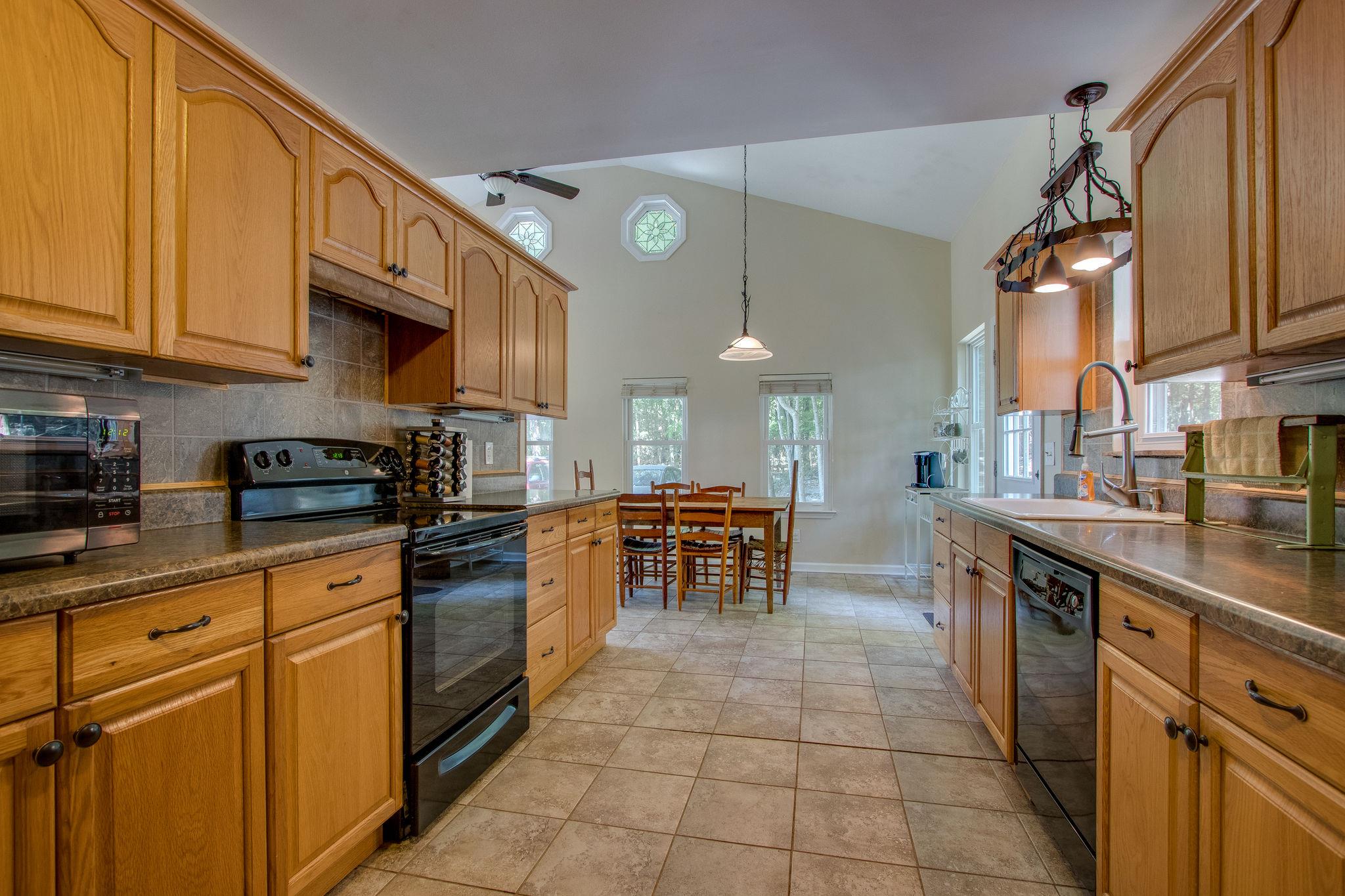 2461 Old Shannon Road Lebanon, TN 37090 - Photo 8 of 30 a kitchen with stainless steel appliances granite countertop a sink and cabinets