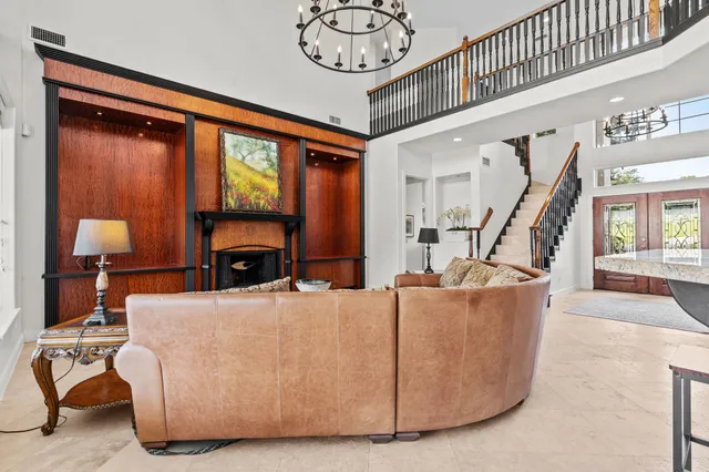 a spacious bedroom with a bed and a large window