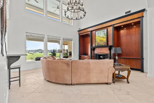 a bedroom with a bed and a large mirror