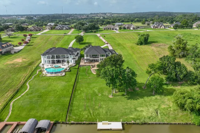 a living room with patio furniture and a potted plant