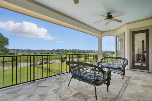 a view of a livingroom with furniture and a window