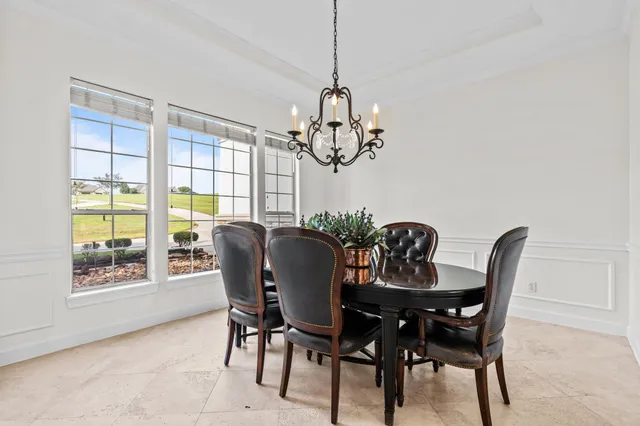 a kitchen with stainless steel appliances kitchen island granite countertop a refrigerator and microwave