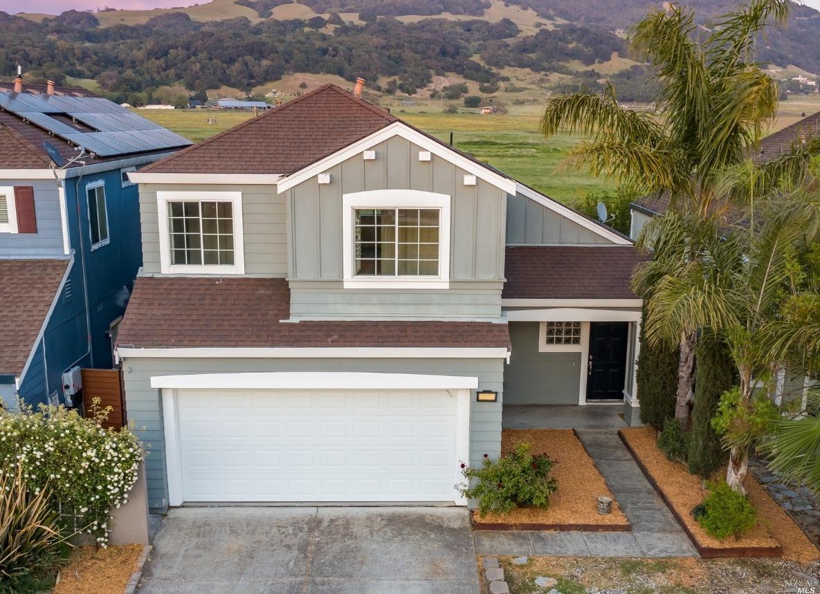 720 Potomac Avenue Santa Rosa, CA 95407 - Photo 1 of 1 a front view of a house with a yard and garage