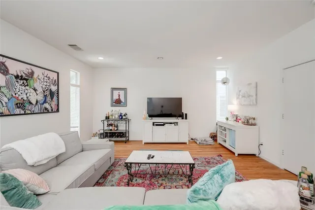 a view of a house with backyard and a tree