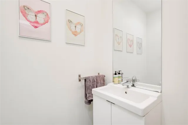 a house view with a car parked in front of it