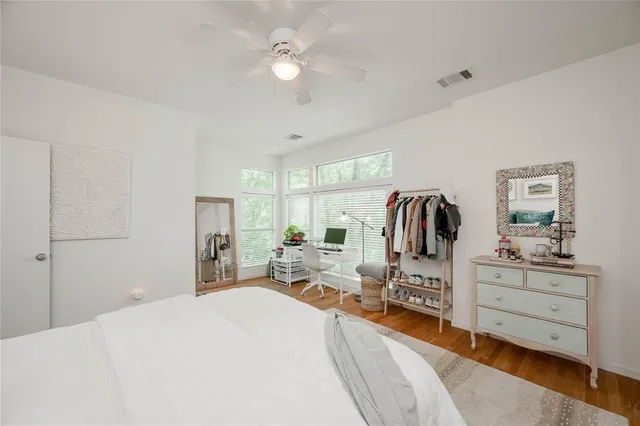 a bedroom with a bed and a desk