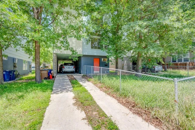 a view of a car in front of a house