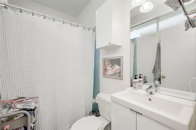 a bed room with a bed and a chair