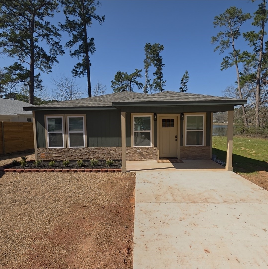620 St Lawrence River Road Conroe, TX 77316 - Photo 1 of 21 front view of a house with a yard