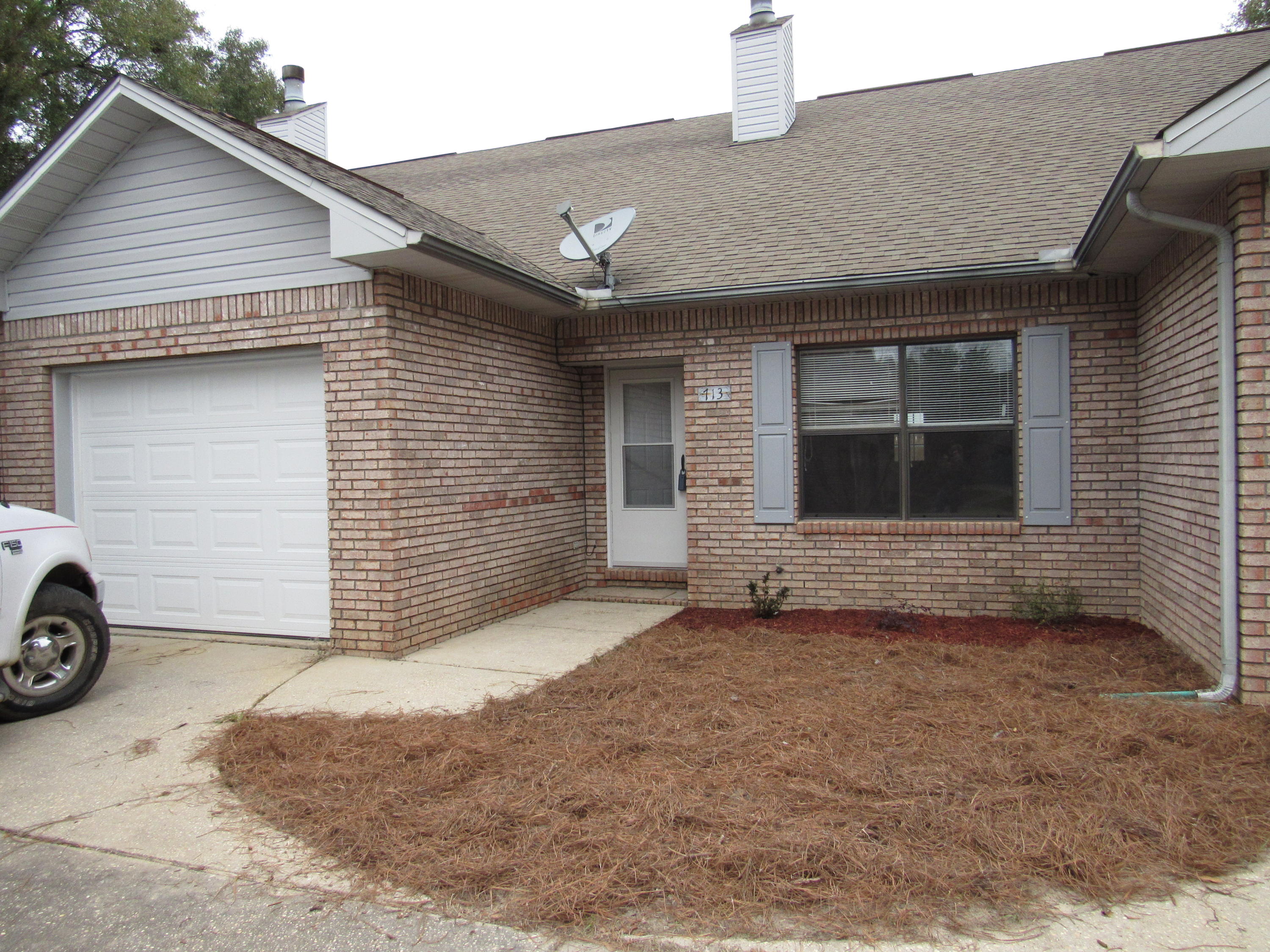 713 Valley Road Crestview, FL 32539 - Photo 1 of 17 a front view of a house with parking space