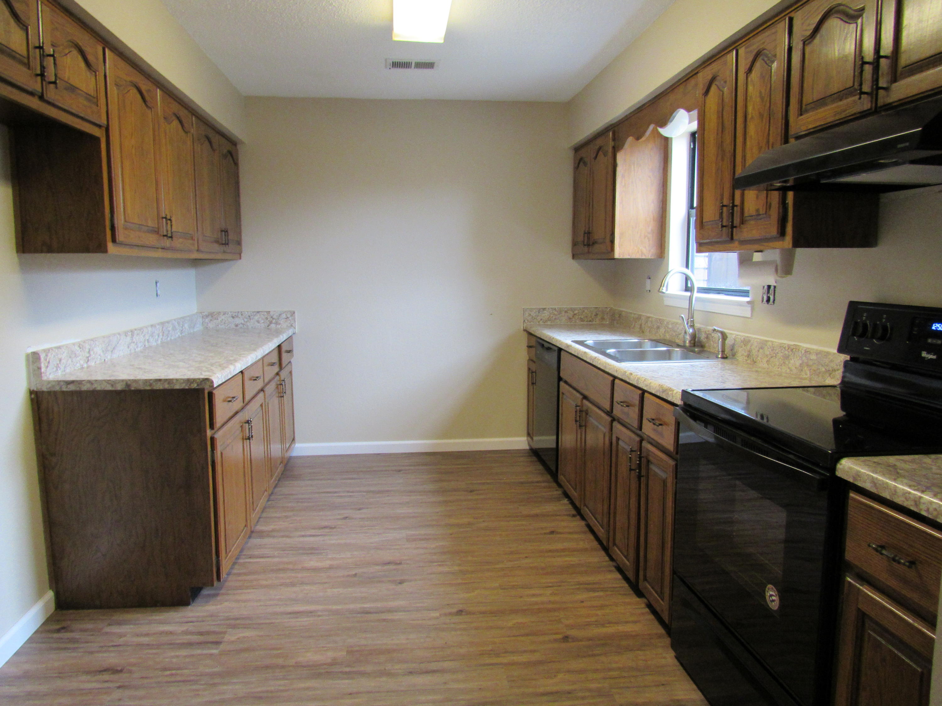 713 Valley Road Crestview, FL 32539 - Photo 12 of 17 a kitchen with a sink stove top oven and cabinets