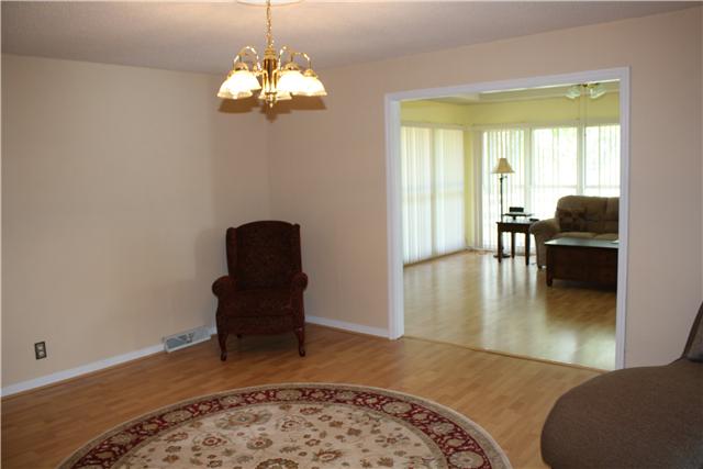 322 Long Road Ardmore, TN 38449 - Photo 6 of 20 Living Room - Features laminate flooring and opens to the family room.