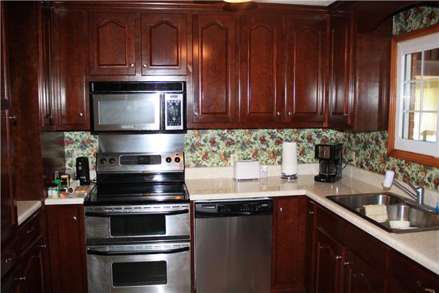 322 Long Road Ardmore, TN 38449 - Photo 10 of 20 Kitchen - Has new vinyl plus stainless steel appliances to include double oven, microwave and dishwasher.