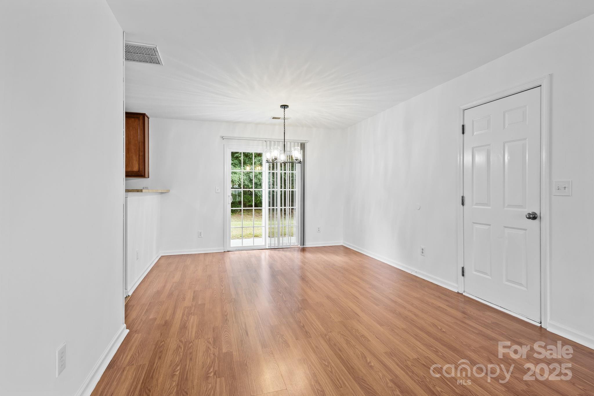 3425 Market View Drive Davidson, NC 28036 - Photo 12 of 23 wooden floor in an empty room with a window