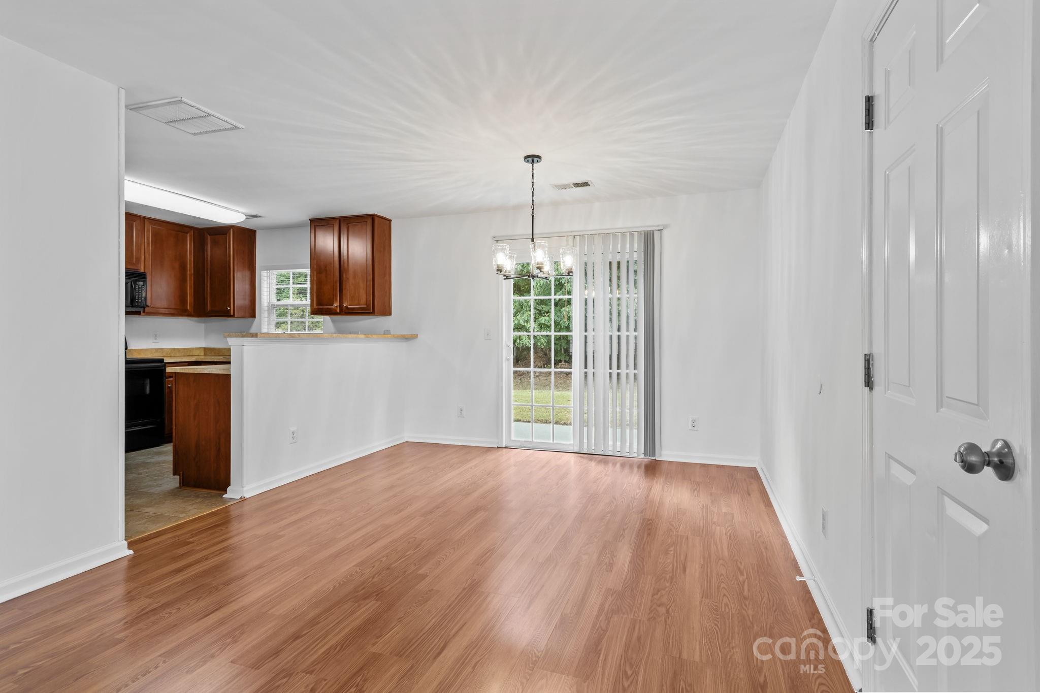 3425 Market View Drive Davidson, NC 28036 - Photo 13 of 23 a view of kitchen and hall with wooden floor