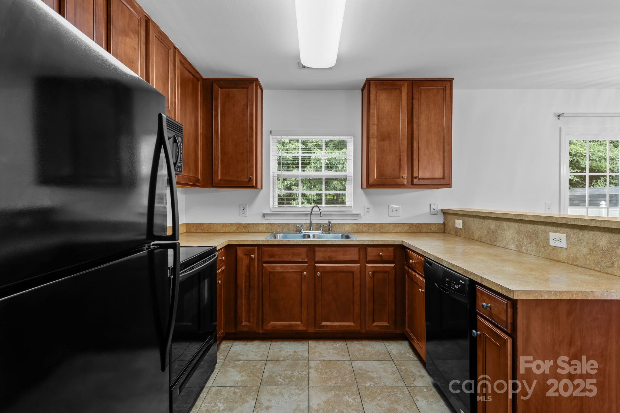 3425 Market View Drive Davidson, NC 28036 - Photo 16 of 23 a kitchen with a sink stove and cabinets