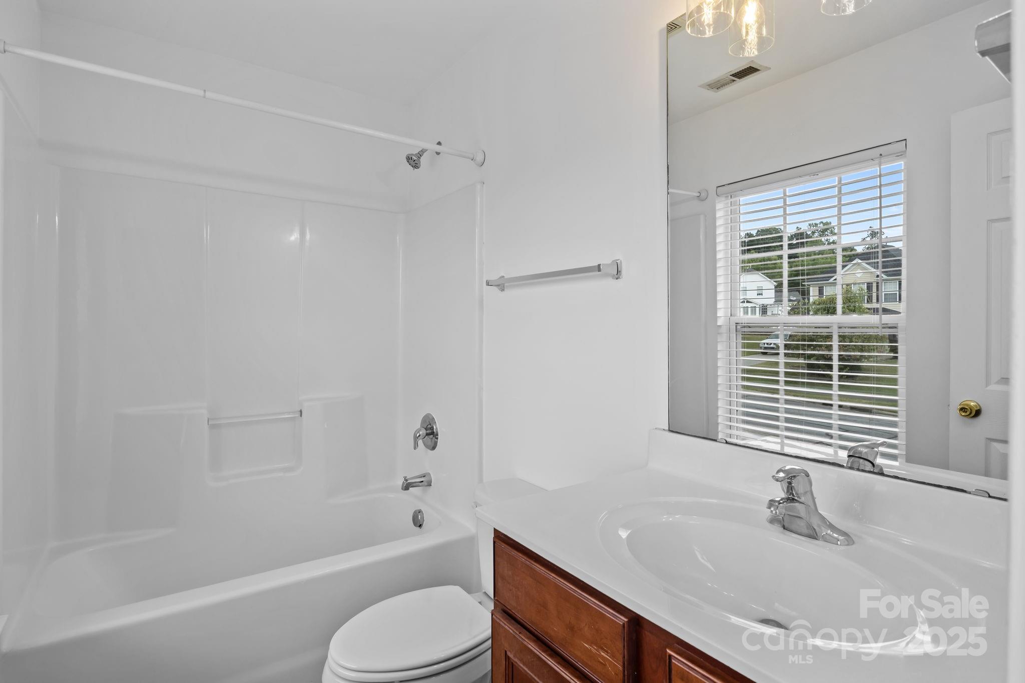 3425 Market View Drive Davidson, NC 28036 - Photo 23 of 23 a bathroom with a granite countertop sink toilet and bathtub