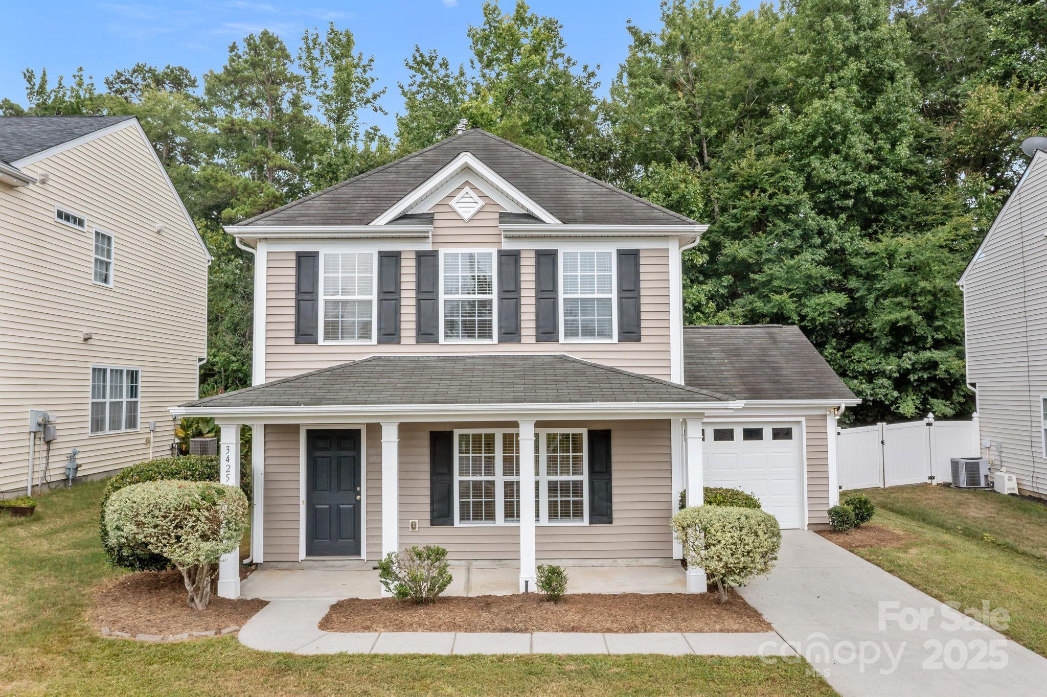 3425 Market View Drive Davidson, NC 28036 - Photo 4 of 23 a front view of a house with a yard and garage