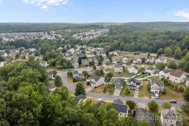 an aerial view of residential building with parking space