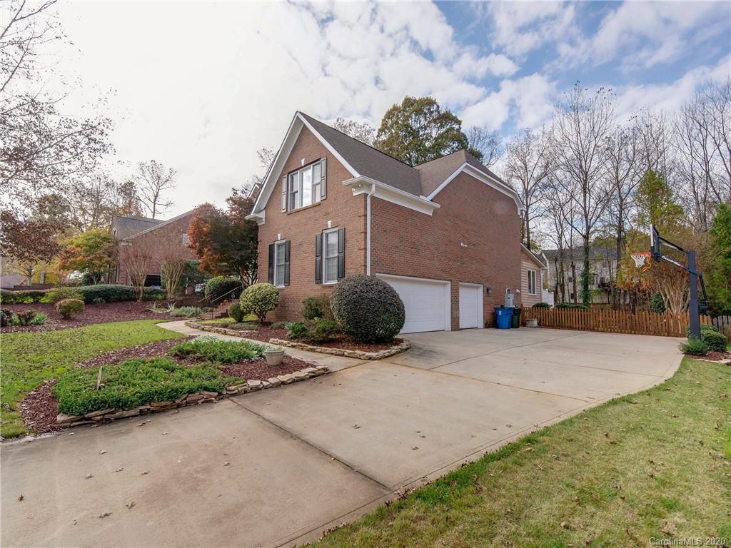 1612 Stevens Ridge Road Matthews, NC 28105 - Photo 2 of 44 a front view of a house with a yard and garage