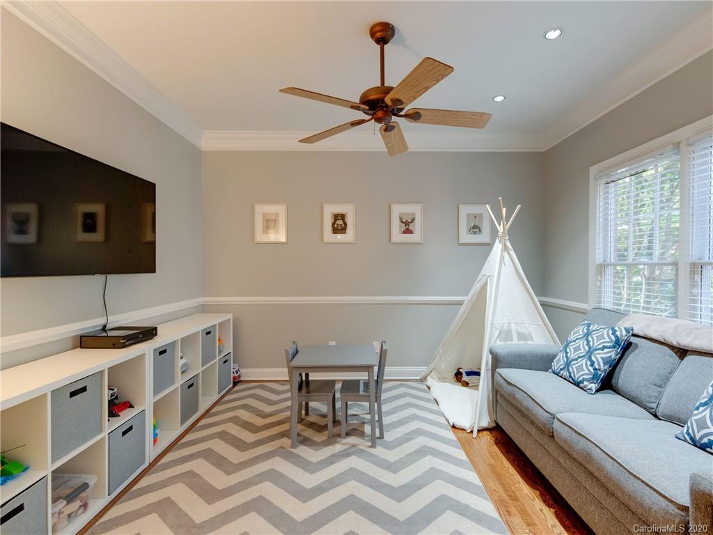1612 Stevens Ridge Road Matthews, NC 28105 - Photo 11 of 44 a living room with furniture and a flat screen tv