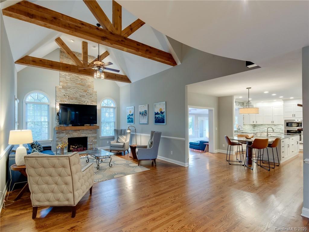 1612 Stevens Ridge Road Matthews, NC 28105 - Photo 12 of 44 a living room with furniture wooden floor and a fireplace