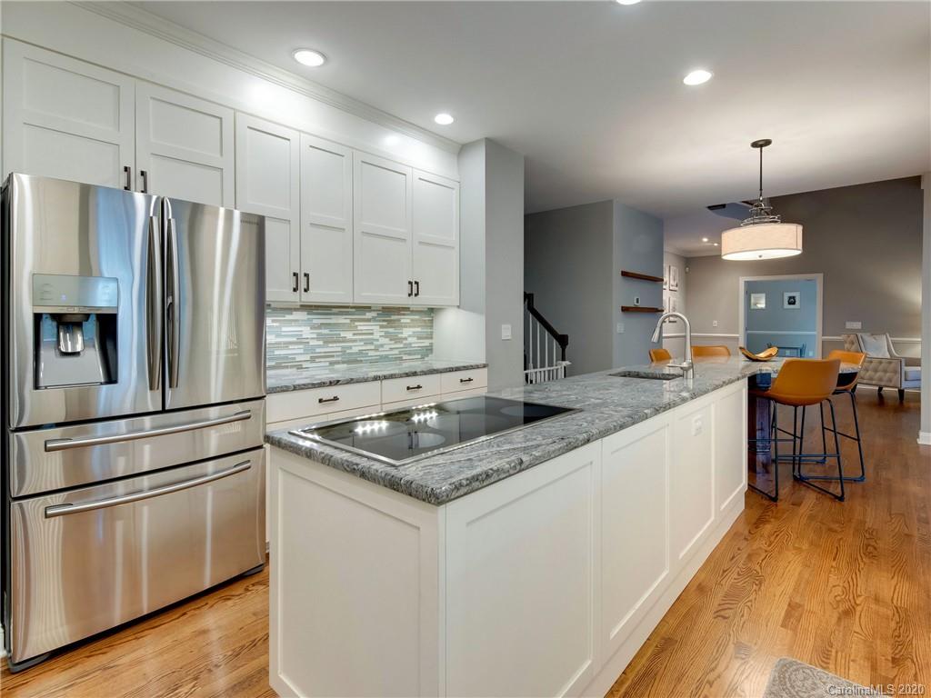 1612 Stevens Ridge Road Matthews, NC 28105 - Photo 17 of 44 a kitchen with stainless steel appliances granite countertop a sink stove and refrigerator