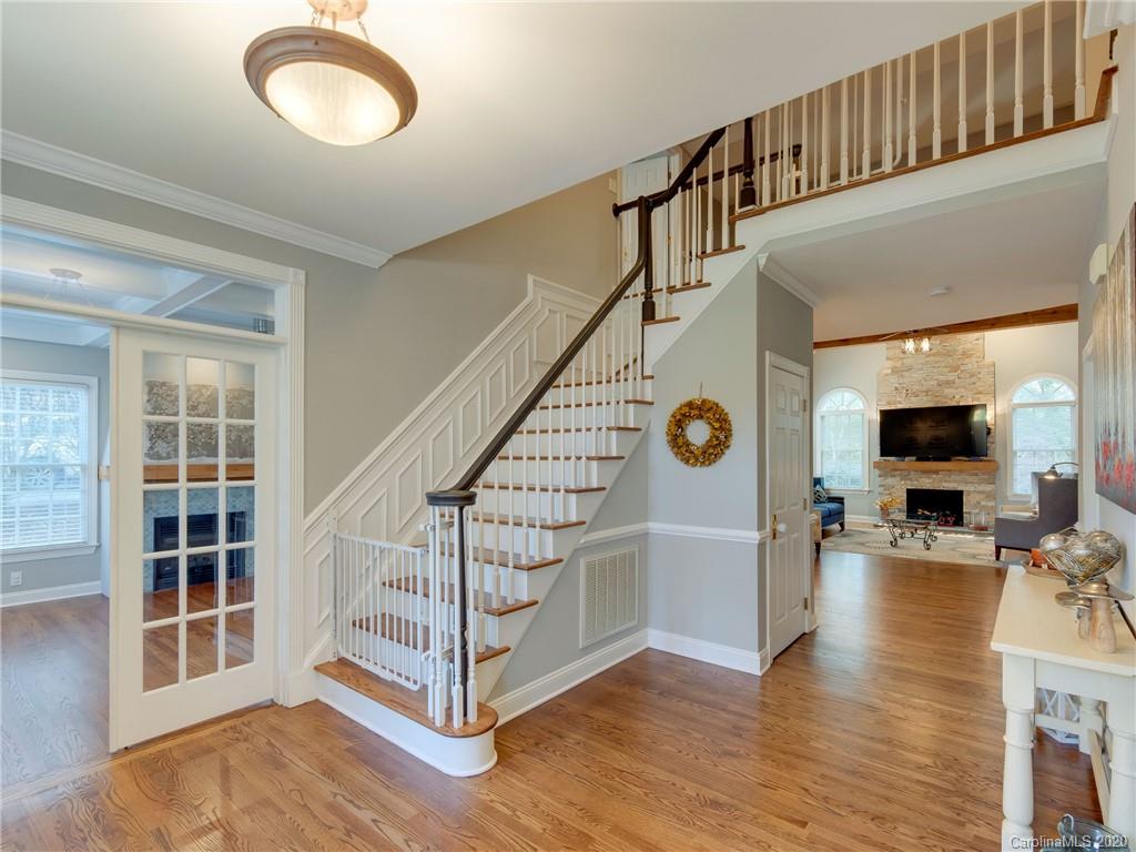 1612 Stevens Ridge Road Matthews, NC 28105 - Photo 4 of 44 a view of entryway livingroom and hall with wooden floor