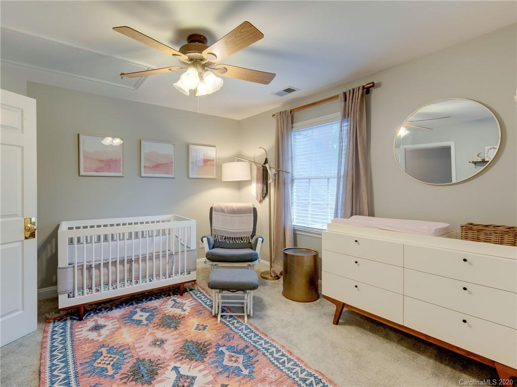 1612 Stevens Ridge Road Matthews, NC 28105 - Photo 31 of 44 a bedroom with a bed and a dresser