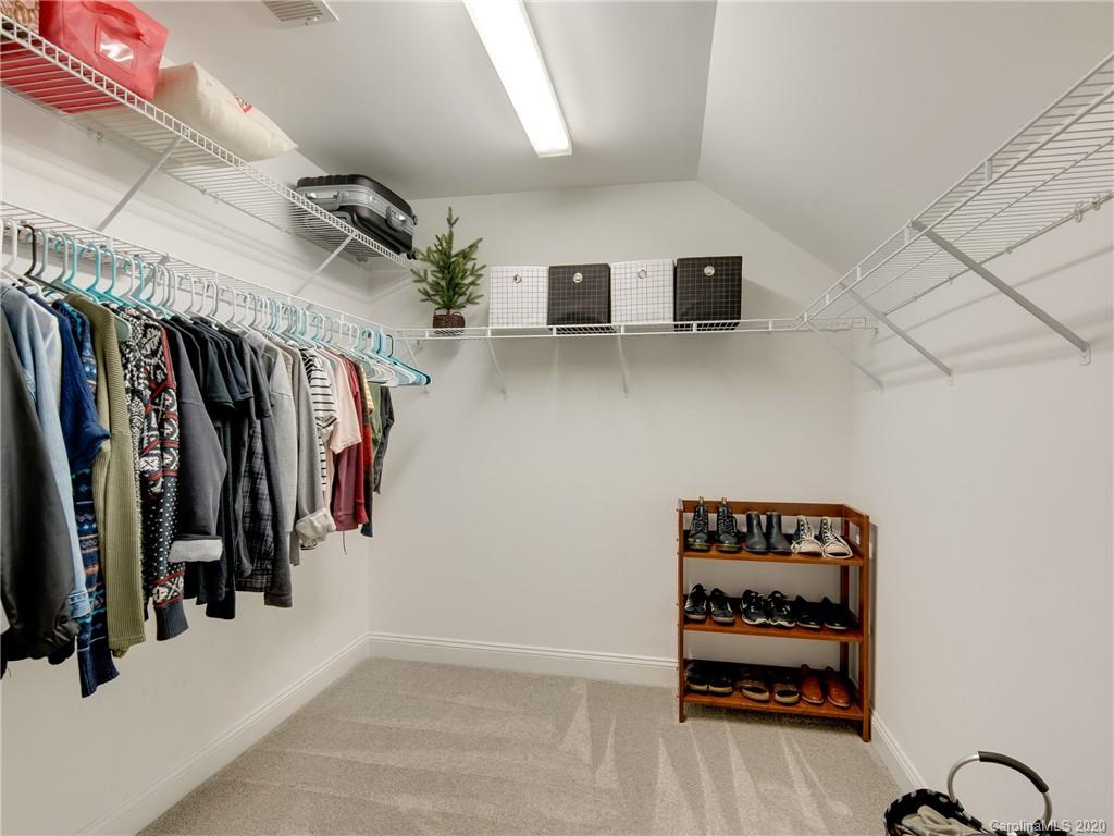 1612 Stevens Ridge Road Matthews, NC 28105 - Photo 36 of 44 a view of walk in closet with clothes and shoes