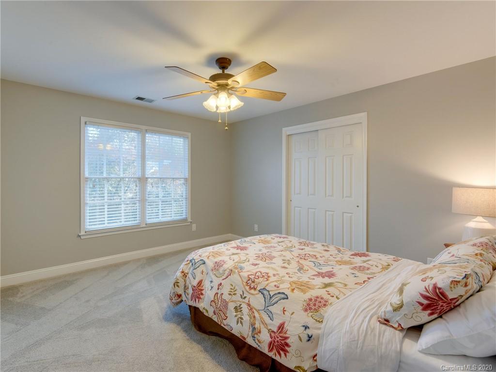1612 Stevens Ridge Road Matthews, NC 28105 - Photo 39 of 44 a bedroom with a bed and a window
