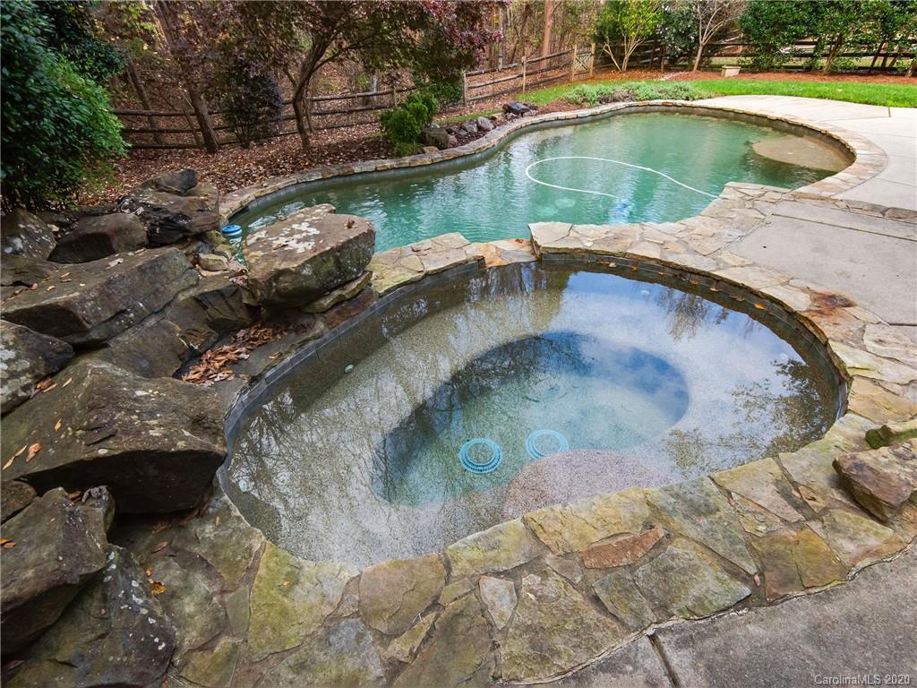 1612 Stevens Ridge Road Matthews, NC 28105 - Photo 41 of 44 a view of a swimming pool with a yard