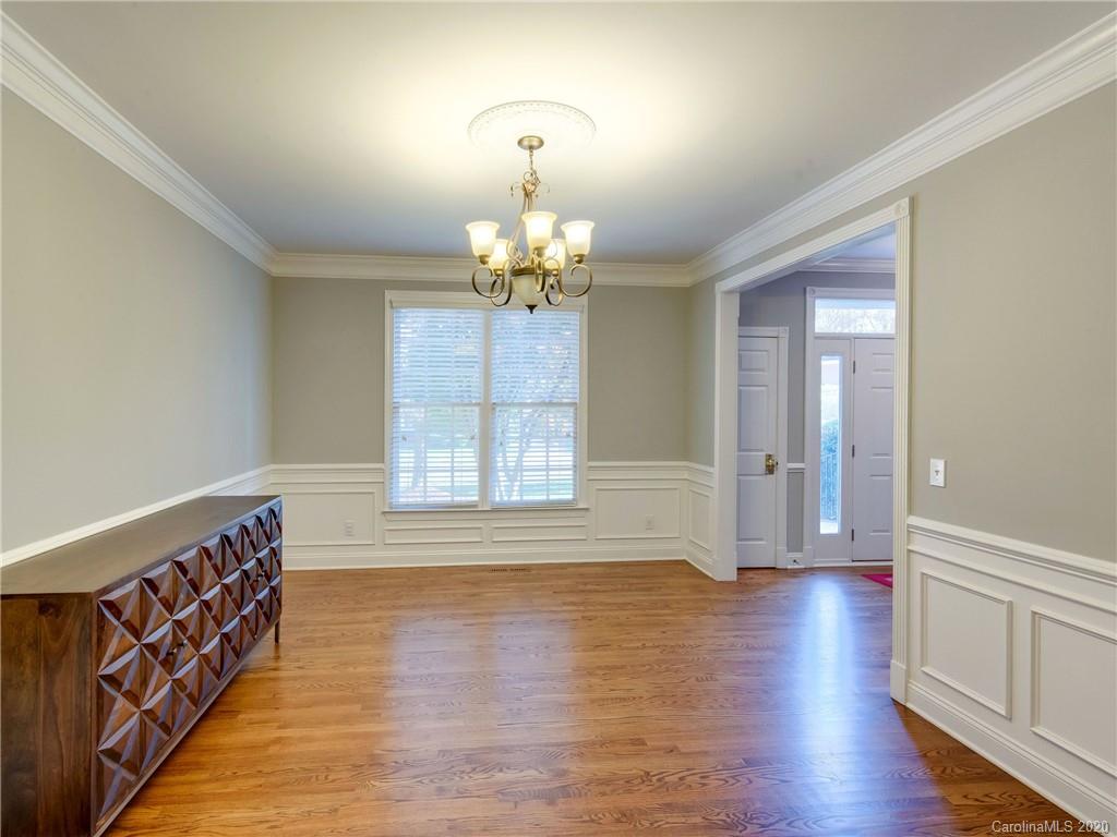 1612 Stevens Ridge Road Matthews, NC 28105 - Photo 8 of 44 wooden floor in an empty room with a window