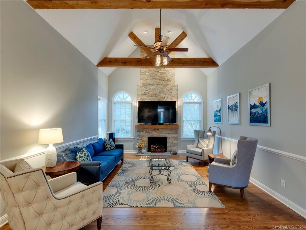 1612 Stevens Ridge Road Matthews, NC 28105 - Photo 10 of 44 a living room with furniture and a fireplace