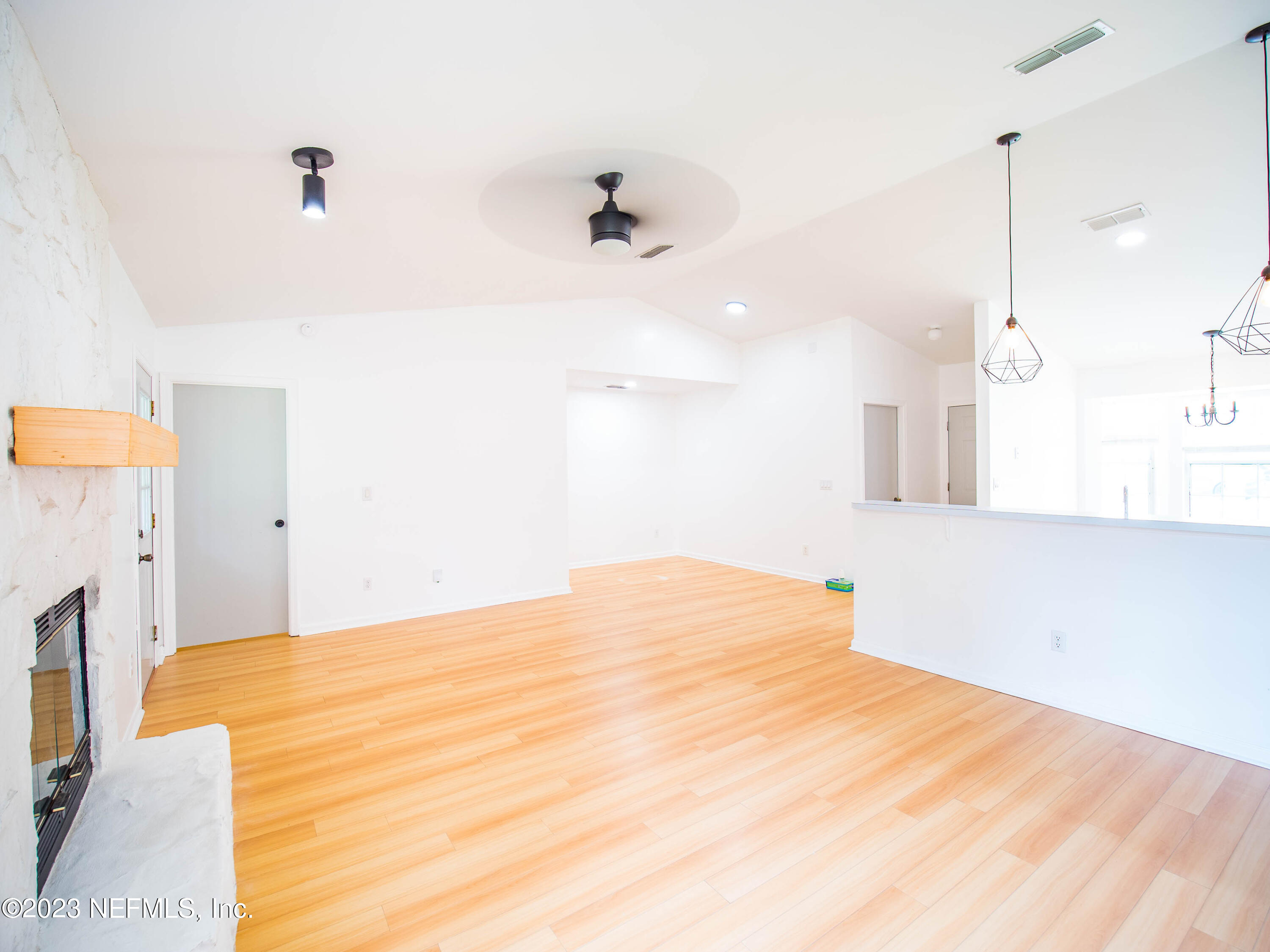 3252 Dowitcher Lane Orange Park, FL 32065 - Photo 13 of 25 a bedroom with a bed and a chandelier