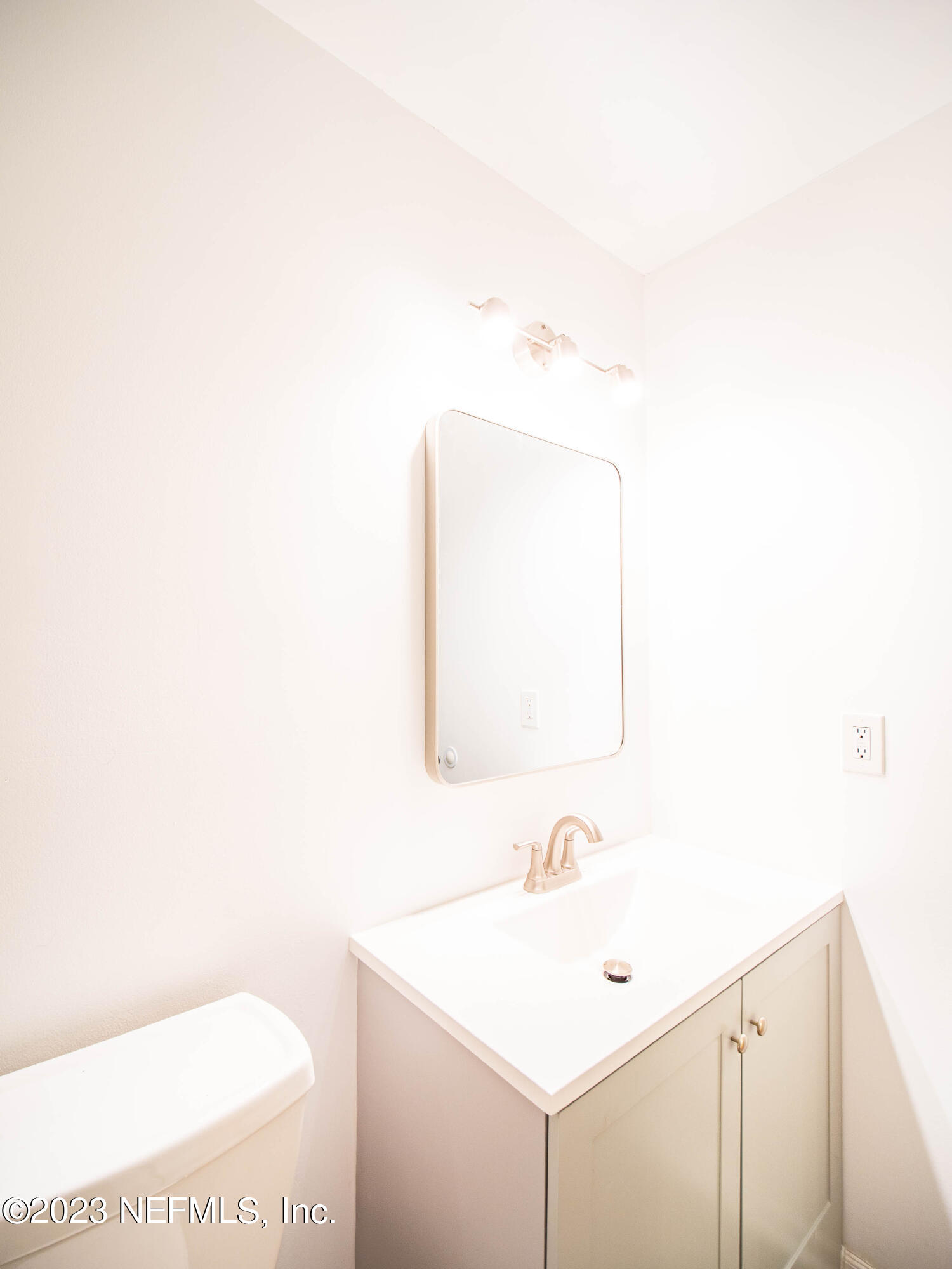 3252 Dowitcher Lane Orange Park, FL 32065 - Photo 15 of 25 a bathroom with a toilet a sink and mirror